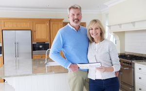 happy couple selling their home